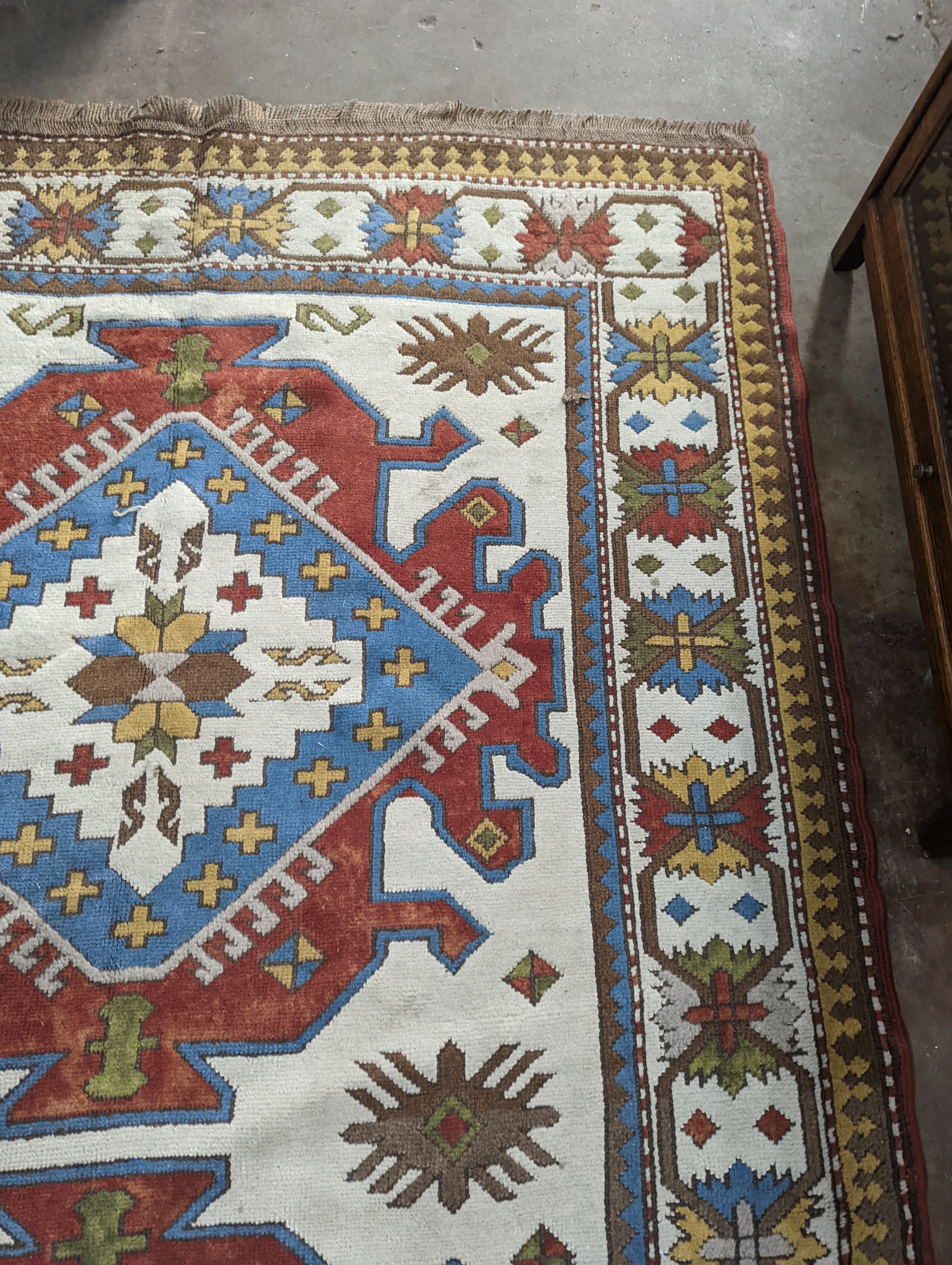 A Caucasian design ivory ground carpet, 270 x 170cm